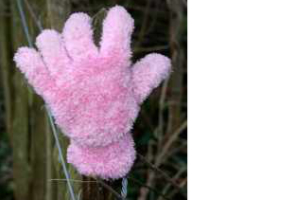 Photograph of one child's pink fleece clove on a stick . Copyright Kim Crowder
