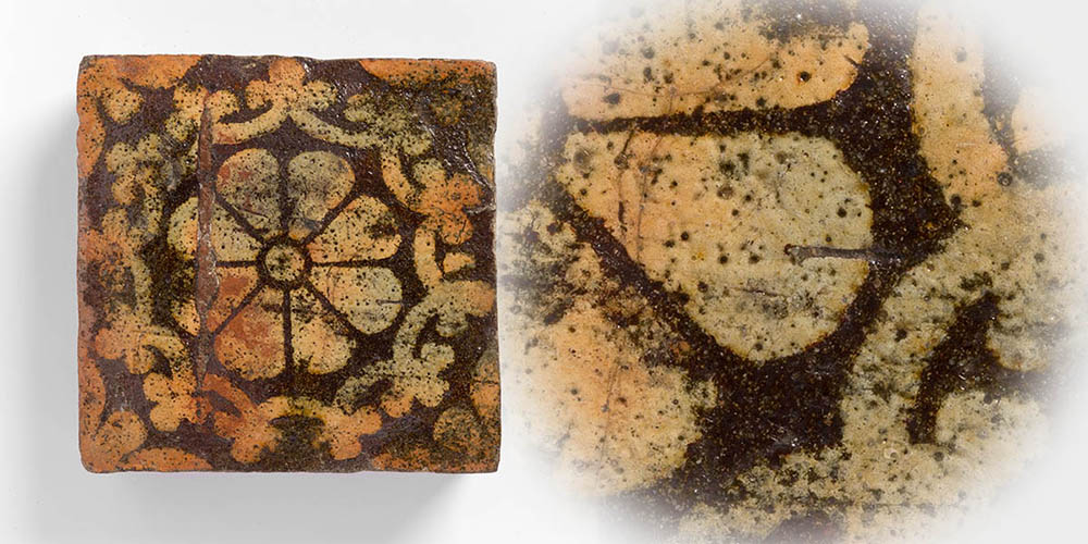 A floor tile from Butley Priory showing a flower, or possibly eight spoked wheel, design together with a close up showing pock marks and bubbles in the slip glaze surface. Photo: FXP Photography, used by permission of Orford Museum.
