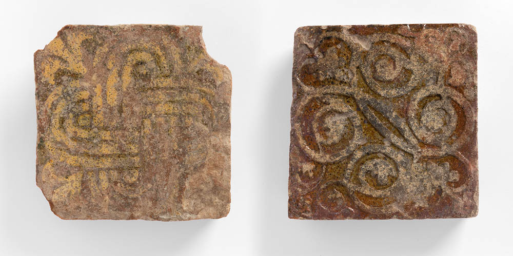 Two Medieval tiles from Butley Priory. Left: Swastica-pelta or Solomon's knot. Right:Interlaced tendrils. Photo: FXP Photography, by permission of Orford Museum.